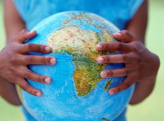 child holding a globe